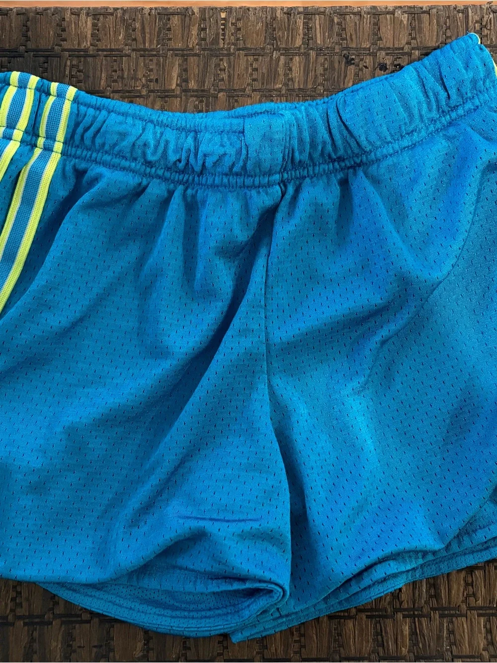 Nike Kids Blue Athletic Shorts with Neon Yellow Stripe